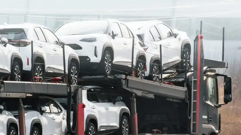 Commercial auto transport carrier hauling vehicles across the continental United States