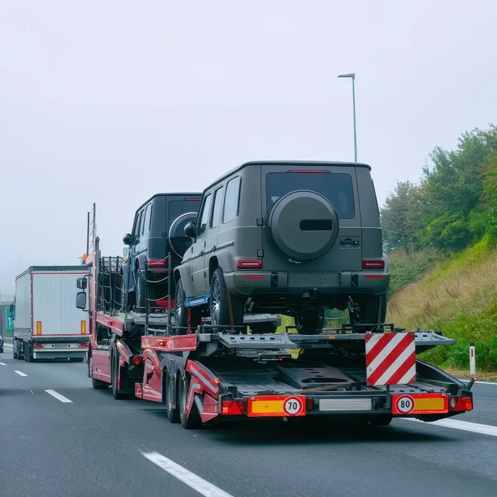 Standard passenger vehicles and SUVs loaded for nationwide open auto transport